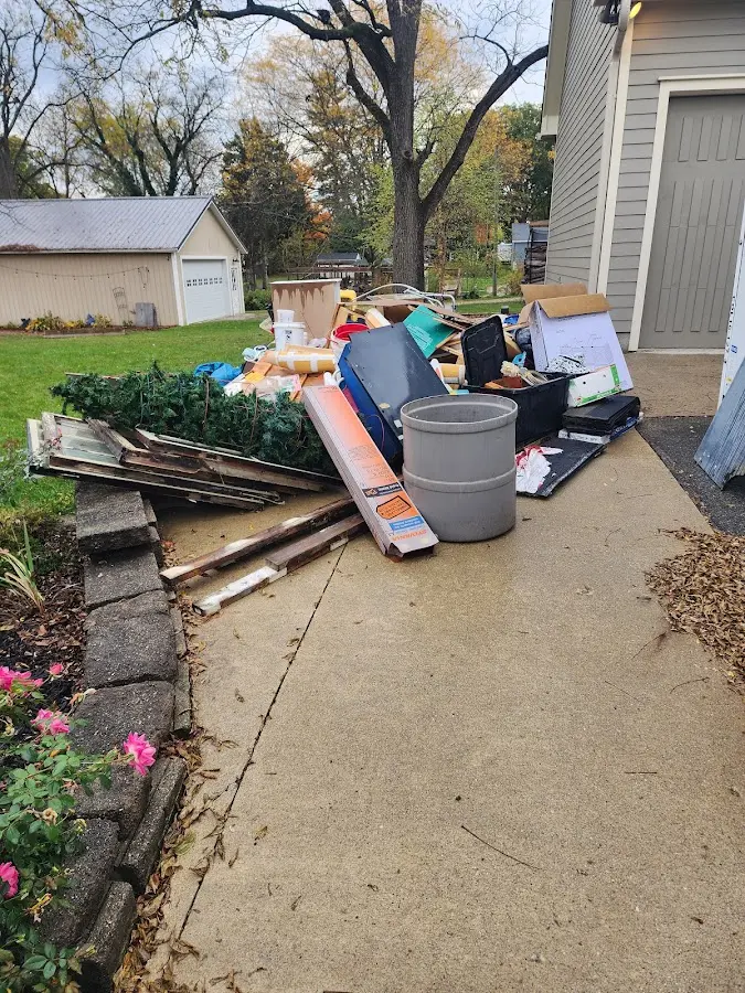 Dumpster being loaded with debris for 10 Yard Dumpster Rental in Hartford